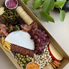 Load image into Gallery viewer, Serves up to 15 people. Large Grazing Boxes help take the stress out of catering your next casual or formal event and suitable for a range of different occasions and includes: Cheese - two hard, two soft Cured meat (300g two varieties - upgrade includes additional 200g) Dip - two variations Antipasti items, dried and fresh fruit (assorted) Including a substantial range of high-quality, locally sourced produce consisting of premium cheese, cold meats, nuts and gluten (unless specified).