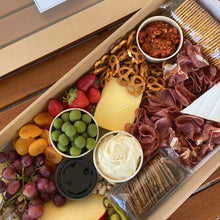 Load image into Gallery viewer, Serves up to 15 people. Large Grazing Boxes help take the stress out of catering your next casual or formal event and suitable for a range of different occasions and includes: Cheese - two hard, two soft Cured meat (300g two varieties - upgrade includes additional 200g) Dip - two variations Antipasti items, dried and fresh fruit (assorted) Including a substantial range of high-quality, locally sourced produce consisting of premium cheese, cold meats, nuts and gluten (unless specified).