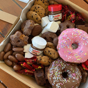 Includes just over 2.1kg of various chocolate and desserts, this box makes a sweet gift or a great companion to your next picnic or movie night.  Regardless of the occasion, we guarantee this is a box you will not get through alone!