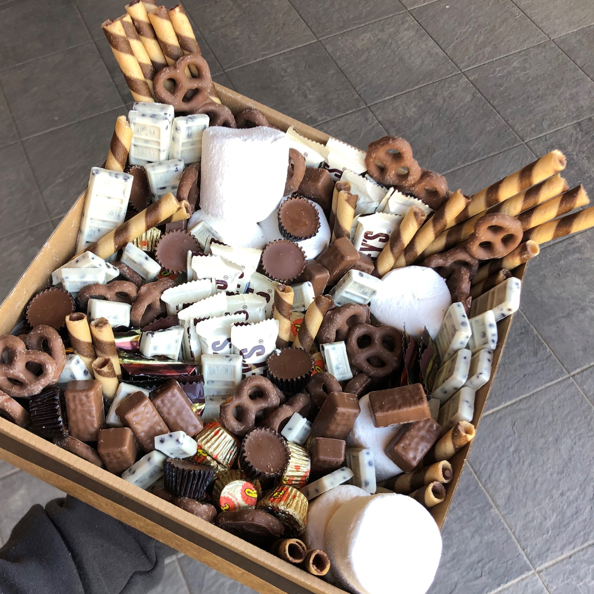 Includes just over 2.1kg of various chocolate and desserts, this box makes a sweet gift or a great companion to your next picnic or movie night.  Regardless of the occasion, we guarantee this is a box you will not get through alone!