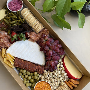 Serves up to 15 people.   Large Grazing Boxes help take the stress out of catering your next casual or formal event and suitable for a range of different occasions and includes:  Cheese - two hard, two soft Cured meat (300g two varieties - upgrade includes additional 200g) Dip - two variations Antipasti items, dried and fresh fruit (assorted) Including a substantial range of high-quality, locally sourced produce consisting of premium cheese, cold meats, nuts and gluten (unless specified).