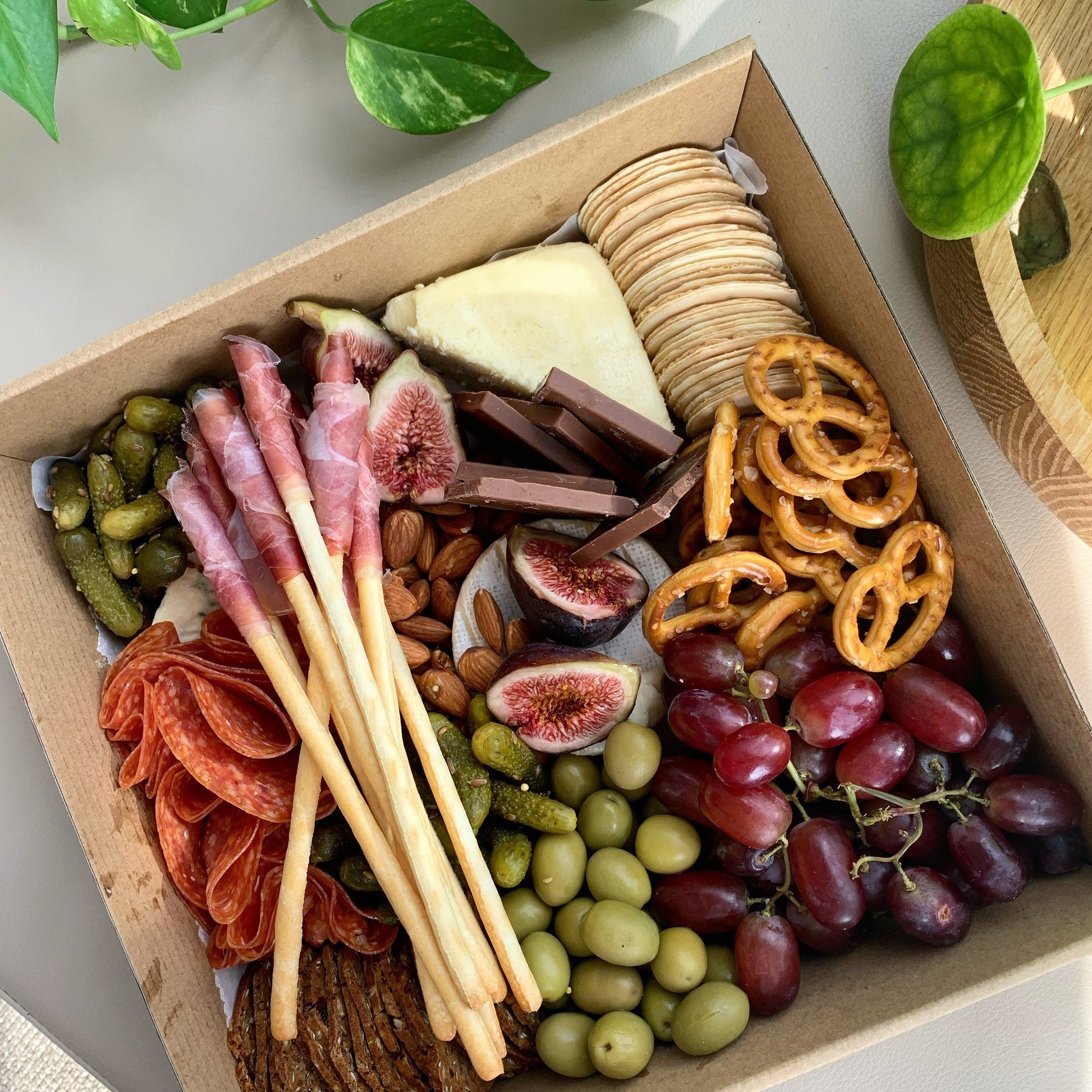 erves 2 to 5 people.  Intimate Grazing Boxes include a range of fresh, high-quality produce to enjoy on any given occasion and contains:  Cheese - one hard, one soft Cured meat (100g - upgrade includes additional 100g) Dip - one variation Antipasti items, dried and fresh fruit (assorted) Indulge alone or give someone the PERFECT gift, hand delivered and ready to enjoy.  Include a premium bottle of West Australian wine or Champagne at checkout.